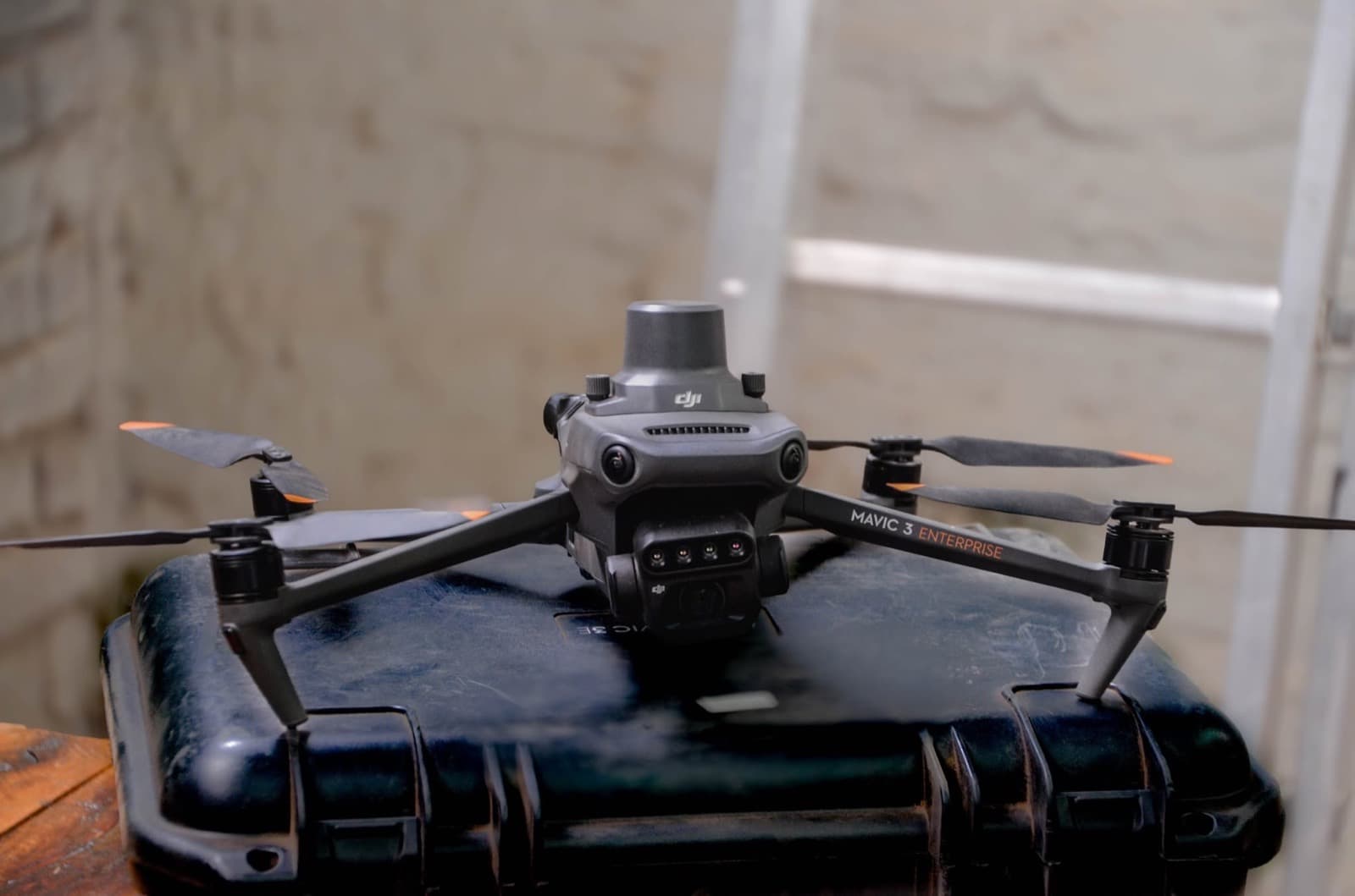 A multispectral survey drone resting on its carry case