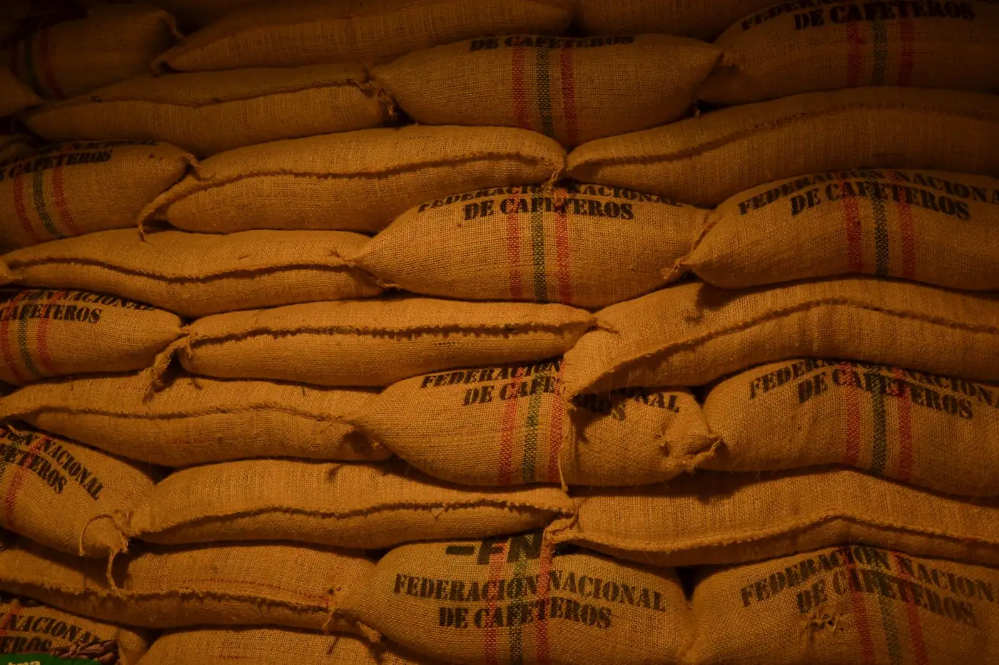 Sacks of export coffee stacked in a warehouse